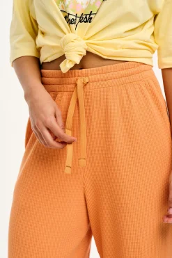 Lucy & Yak Larson - Wide Leg Waffle Cotton Joggers in Sunset Orange Sale